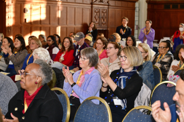 Alums sitting in the audience at cocktail hour